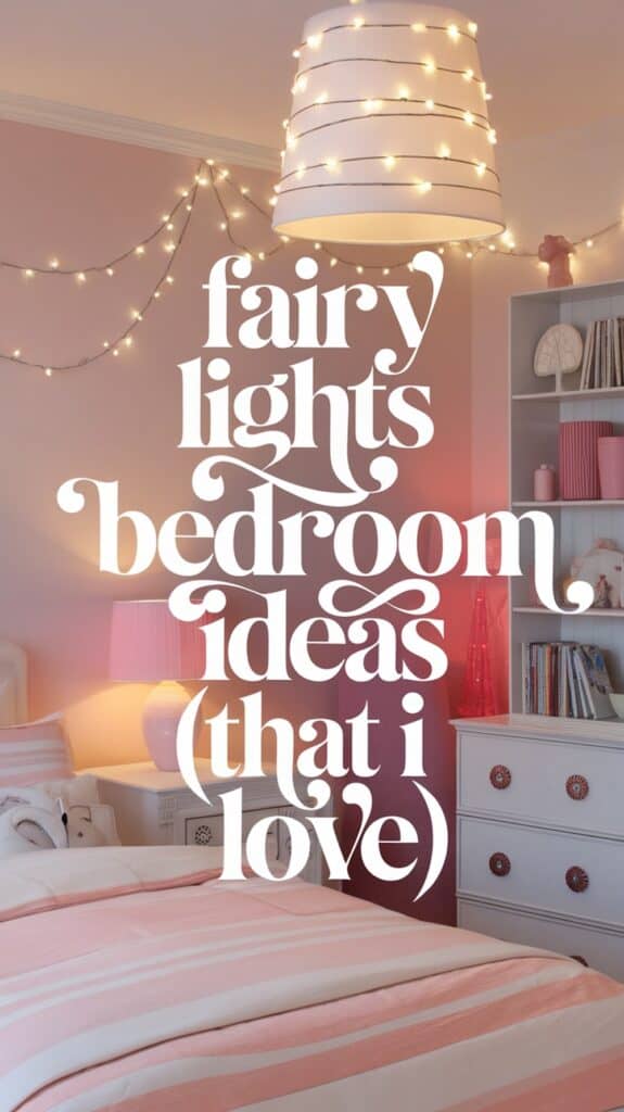 A bedroom with pink walls and a cozy atmosphere is decorated with hanging fairy lights. The bed has a pink and white striped duvet, and a lamp on the nightstand matches the room's color theme. The text "fairy lights bedroom ideas (that I love)" is overlaid on the image.