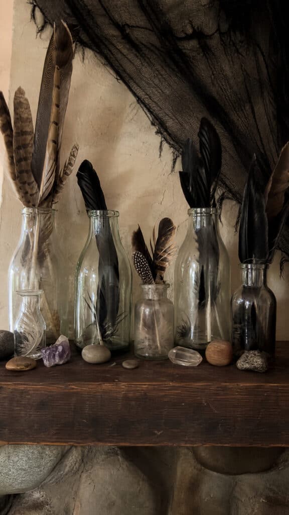 Feather Display In Vintage Bottles