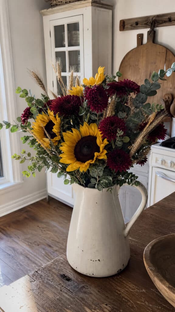 Fresh Or Faux Floral Arrangement In A Pitcher